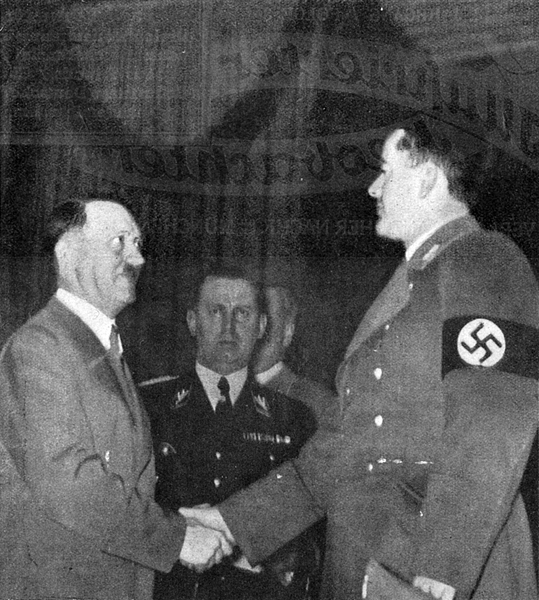 Adolf Hitler greets Albert Speer in Berlin's Sportpalast on the occasion of the inauguration of the new chancellery